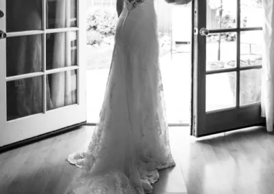 A bride standing in front of a door.